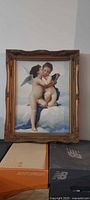 Front view of framed cherub print on cloud