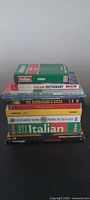 Stack showing all ten Italian books and DVDs