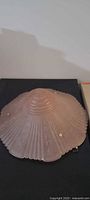 Top view of pink glass ceiling shade showing ribbed pattern and ruffled edge