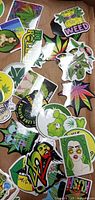 Assorted weed themed stickers spread in box