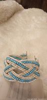 Front view of turquoise and white seed bead cuff bracelet