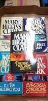 Front view of all five Mary Higgins Clark paperbacks in box