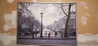 Framed wall print showing Amsterdam canal and red bicycle