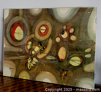 Full view of framed abstract bird composition