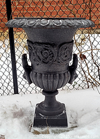 Front view showing urn design and pedestal
