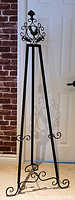 Full view of black cast metal floor easel