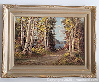 Frontal view of framed Otto Planding landscape painting