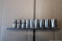 Side view of all sockets lined on rail