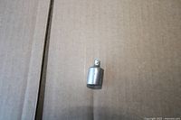 Steel socket adapter showing drive and socket ends