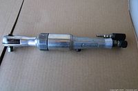 Side view of Snap-On 3/8" drive air ratchet showing entire body and fittings