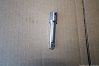 Full view of steel 3/8" drive 3" extension bar