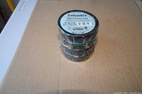 Stack of three Columbia vinyl electrical tape rolls shrink wrapped