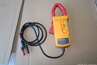 Front view of Fluke i410 current clamp with cable and banana plugs