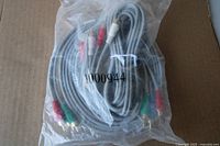 Bagged gray RCA cable set showing red, white, green connectors