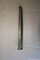 Full view of brass pin punch showing length and surface wear