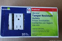 Front of sealed Leviton 10-pack box showing product name, rating and tamper resistant feature
