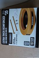 Front of retail box showing product details and image of wax ring with bolts