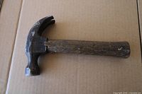 Full view of claw hammer laid flat