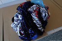 Bundled multicolor braided rope hammock on surface