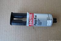 Front view of Loctite Fixmaster Poxy-Pak epoxy cartridge