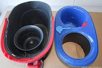 Bucket with lid removed showing black spin basket and interior