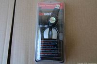 Front view of sealed Gigaware optical travel mouse in blister packaging