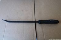 Side view of Snap-On pry bar showing angled tip and handle