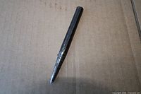 full view of center punch on cardboard