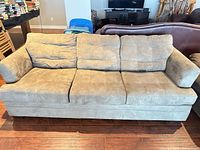 Front view of 3-seat grey-beige microfiber sofa with cushions in place