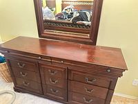 Front view showing dresser top, drawer layout, mirror