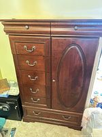 Front view showing entire chest, drawers, cabinet door and finish