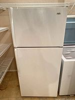 Front view showing complete Inglis white top-freezer refrigerator