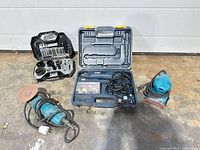Overview of all items: angle grinder, rotary tool kit in case, hole saw set in case, random orbital sander