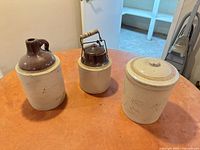 Front view of three stoneware pieces on table