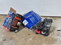 Pump, box and packaged hoses on floor