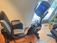 Left side view showing full bike, seat, pedals, console