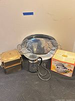 Group shot showing platter, ice bucket, espresso maker and boxed pasta maker