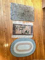 All three rugs laid out on wooden floor
