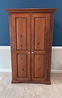 Front view of pine armoire closed