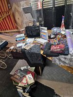 Wide view showing books, tapestries, display rack, beaded curtain, portfolio case