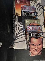 Five Butcher comics and one Dark Shadows comic arranged on table