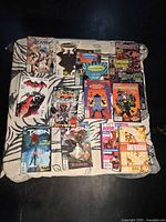 All twelve comic books laid out to show fronts