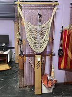 Overall lot with hammock chair, bead curtain, wind chimes, bamboo mat, folded textiles, pouches