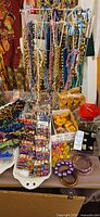 rack with hanging bead strands, packaged cube beads, stretch bracelets, loose novelty beads