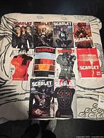 All ten Scarlet comic books laid out in two rows