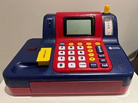 Front angled view of Learning Resources cash register showing LCD, keypad, swipe card