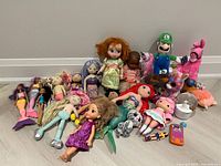 Group shot of all dolls and plush toys