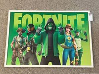 Full view of framed Fortnite poster with characters and logo