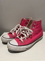 Three-quarter view of both sneakers showing colour, laces, toe caps and side profile