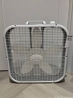 Front view showing full fan grille and blades